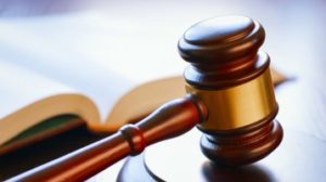 A judge's gavel sitting on a table.