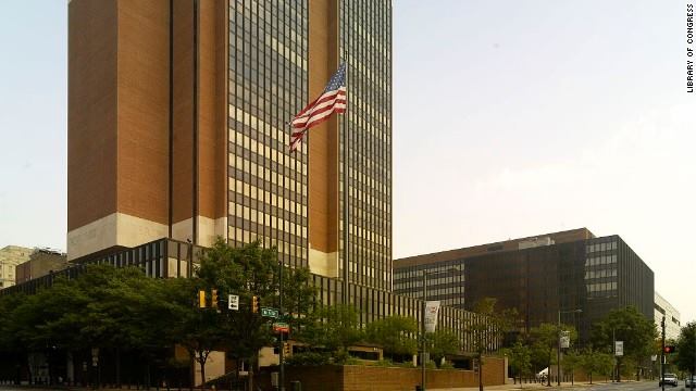A large building with the American flag out front.