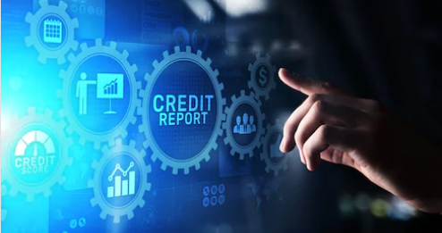 A person looking at a screen with different images. One image says "credit report."